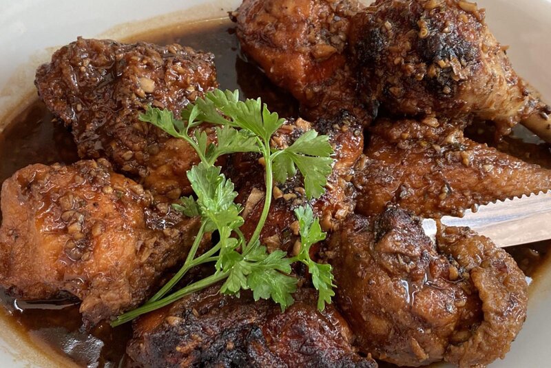 Fried chicken topped with parsley
